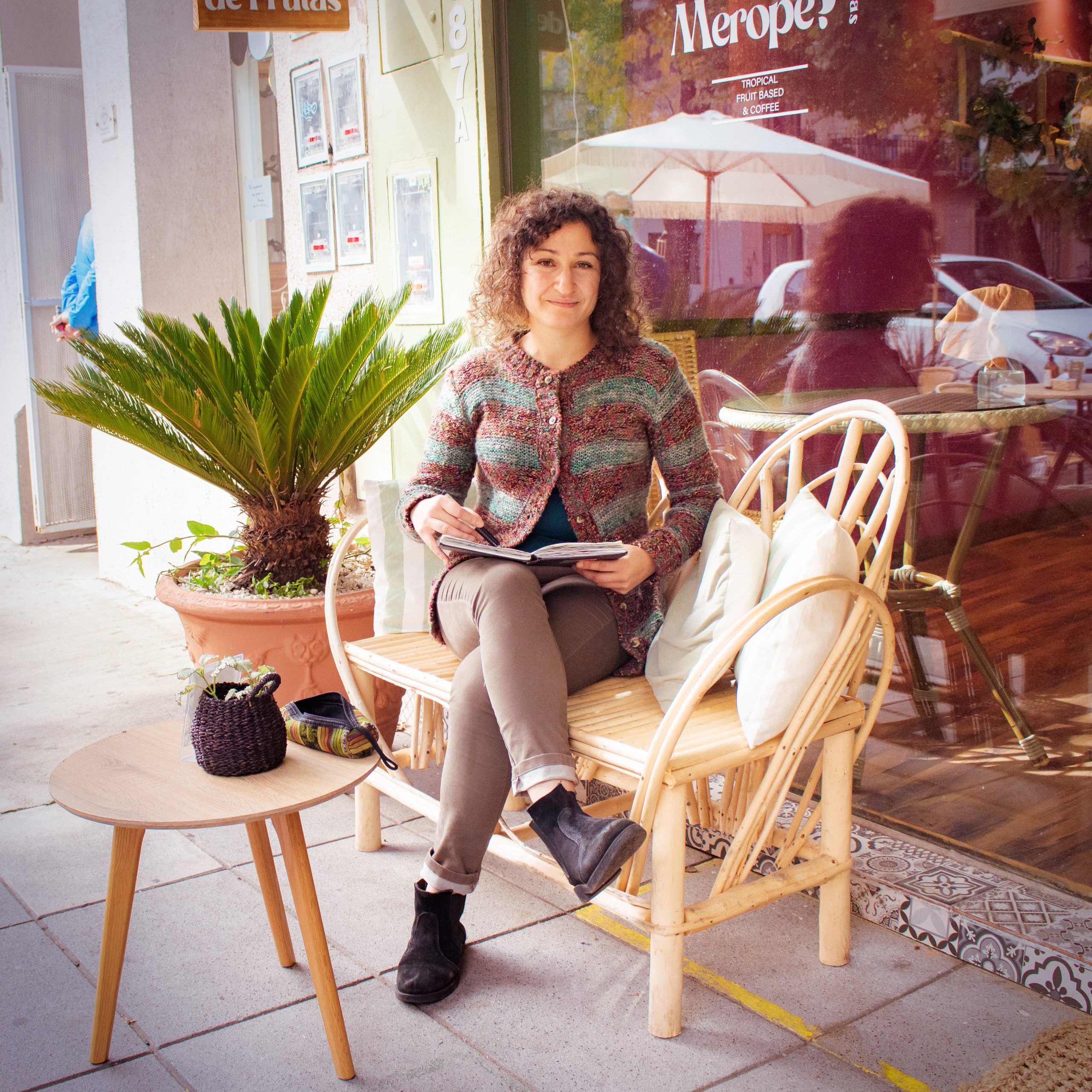 Tatjana Blank, media designer and artist, sitting in a cafe, sketching