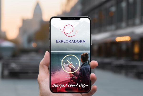 Exploradora E-Commerce on a phone screen, on the street